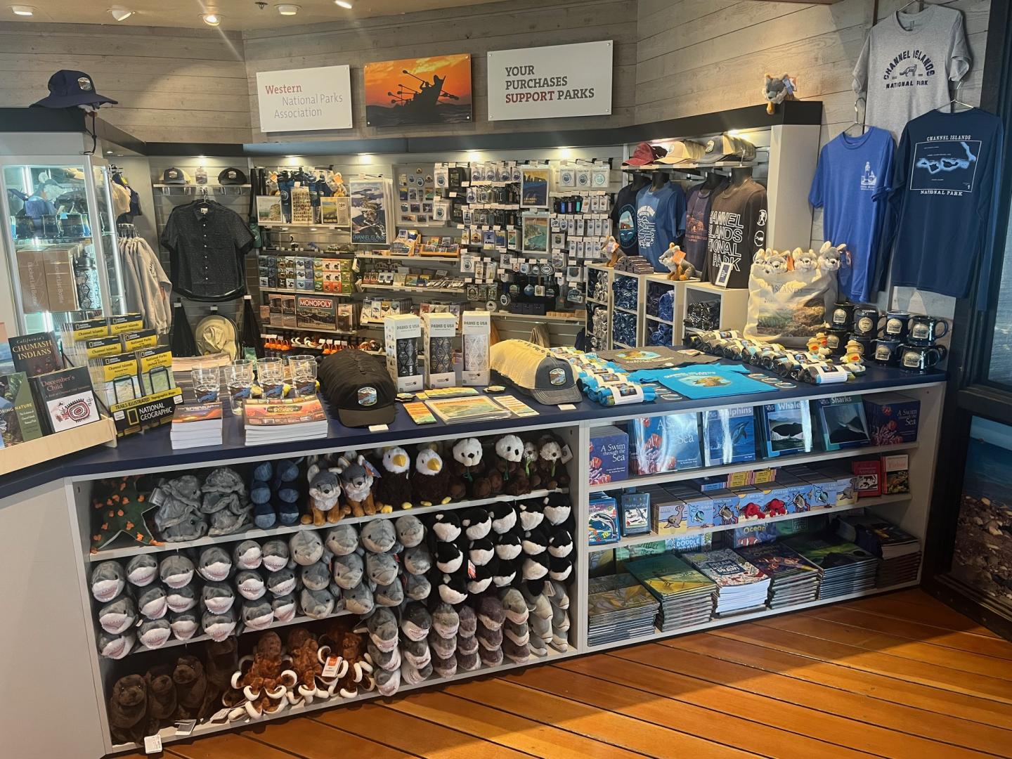 Gift shop with various souvenirs and apparel on display.
