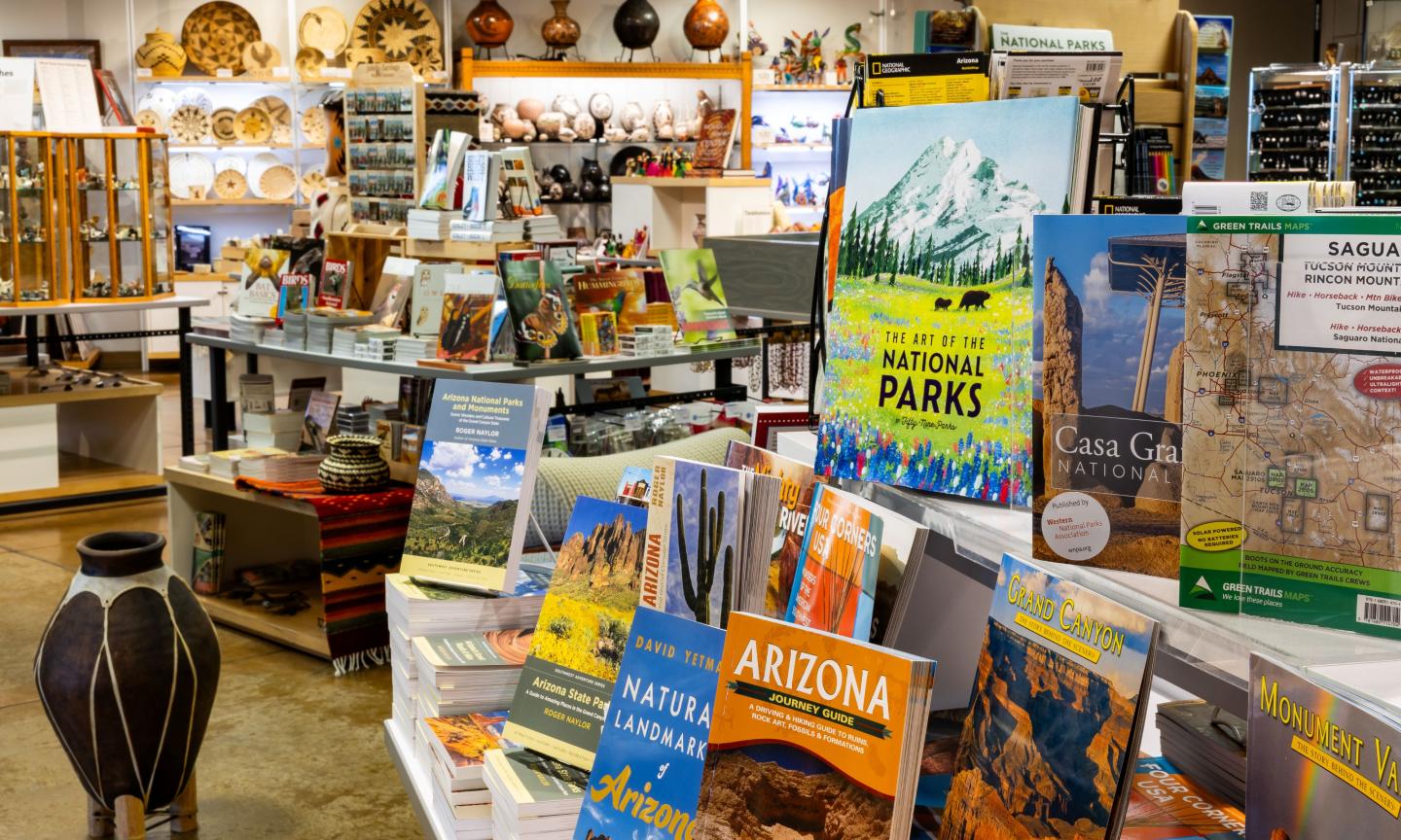 Bookstore with travel guides and souvenirs displayed on shelves.